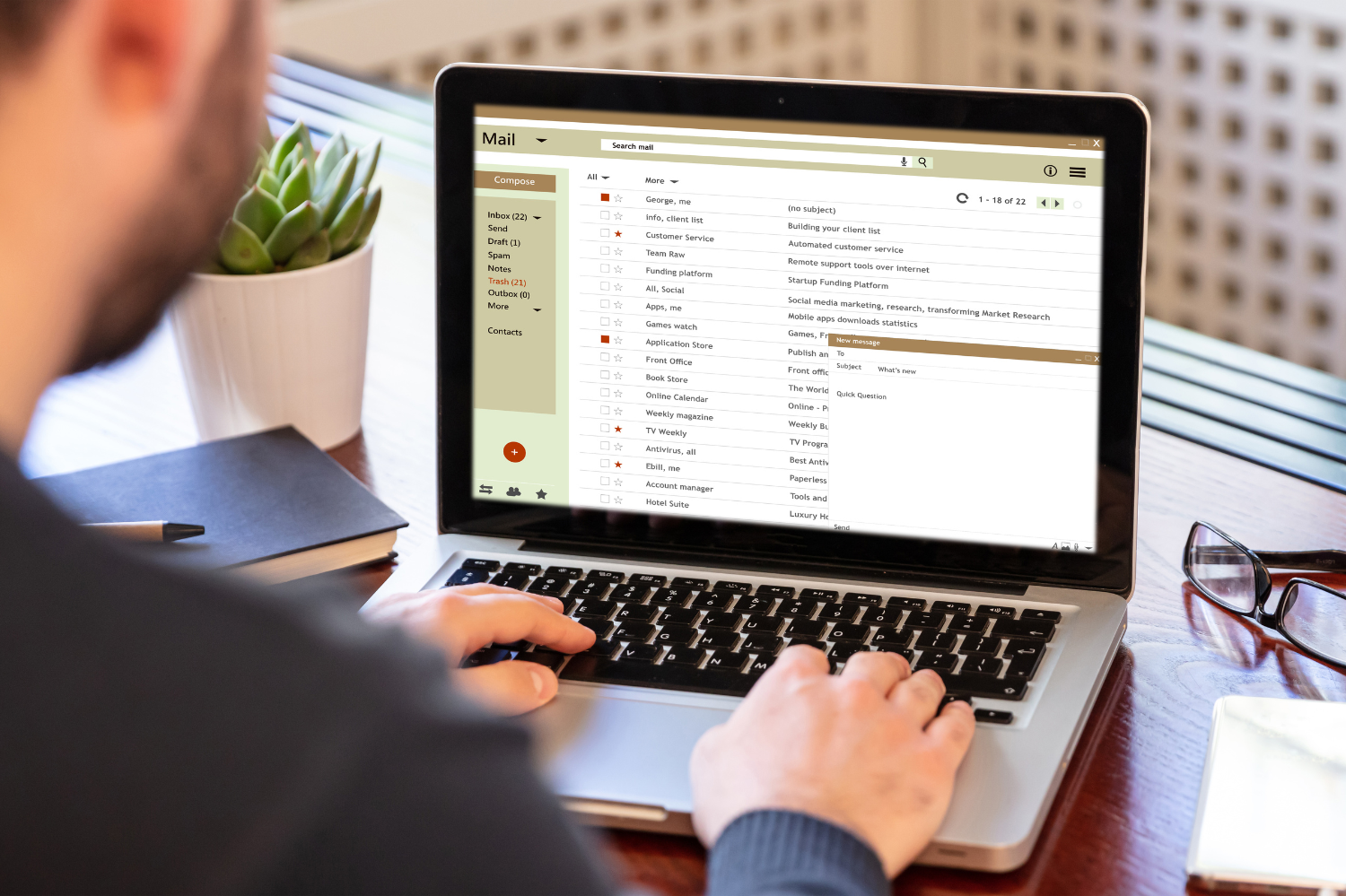 A person using a laptop to check their email inbox, ensuring a clean email list. 