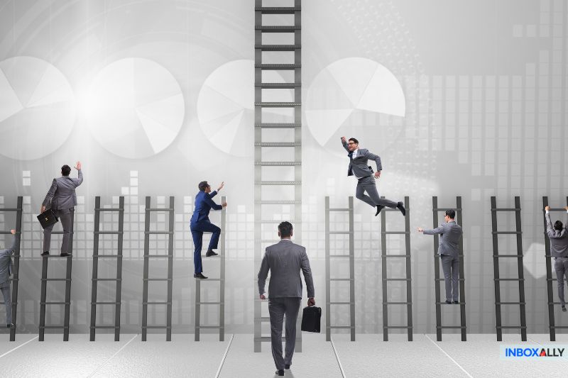 Businesspeople in suits climb ladders against a backdrop of abstract charts, embodying the spirit of success. One person stands at the bottom of a central ladder, holding a briefcase, ready to embark on their competitive email marketing journey.