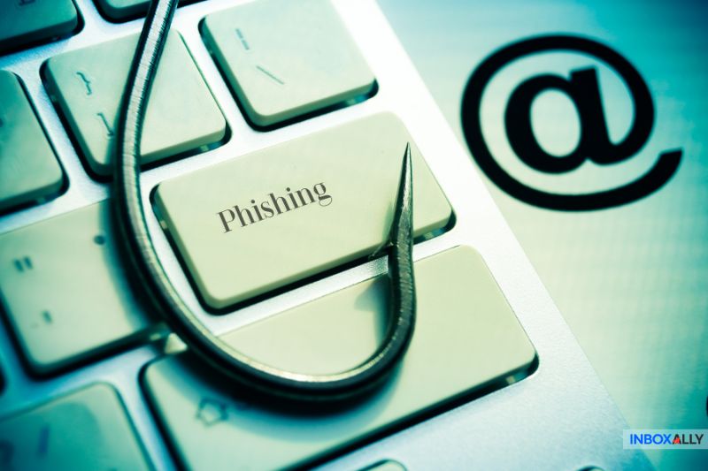 Spam gateway blocking phishing attacks—computer keyboard with fishing hook symbolizing email threats stopped by advanced spam filtering systems.